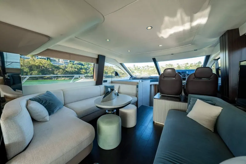  Yacht Photos Pics Luxurious interior of 2018 Azimut Flybridge yacht with modern seating and panoramic windows.