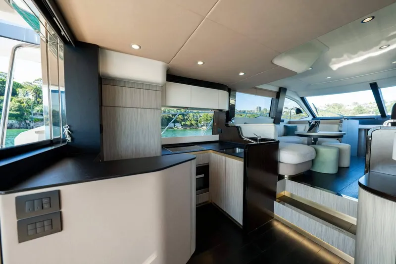  Yacht Photos Pics Luxurious interior of 2018 Azimut Flybridge yacht with modern kitchen and seating area.