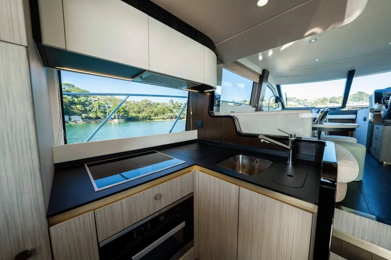  Yacht Photos Pics Luxurious 2018 Azimut Flybridge yacht interior with modern kitchen and scenic water view.