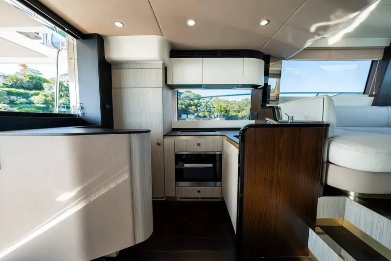  Yacht Photos Pics Luxurious interior of 2018 Azimut Flybridge yacht with modern kitchen and seating area.