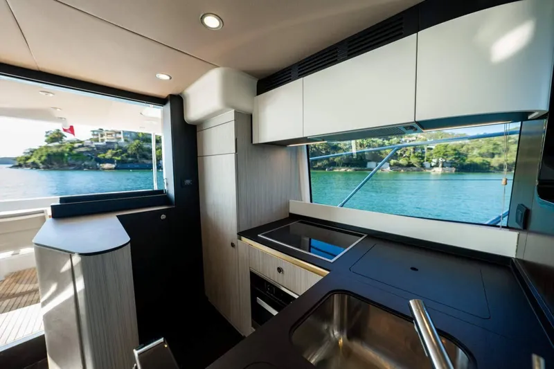  Yacht Photos Pics Luxurious 2018 Azimut Flybridge yacht kitchen with modern design and scenic water view.