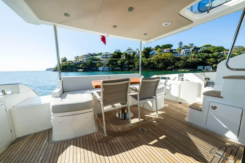  Yacht Photos Pics Luxurious 2018 Azimut Flybridge yacht deck with seating, overlooking scenic waterfront homes.