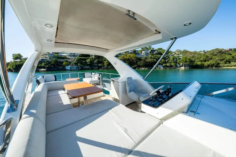  Yacht Photos Pics Luxurious 2018 Azimut Flybridge yacht with spacious deck and scenic waterfront view.