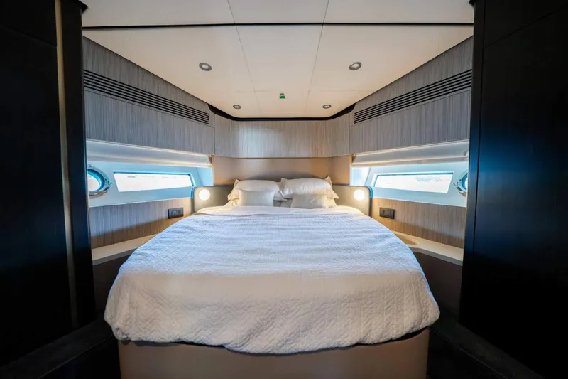  Yacht Photos Pics Luxurious 2018 Azimut Flybridge yacht bedroom with modern design and cozy bedding.