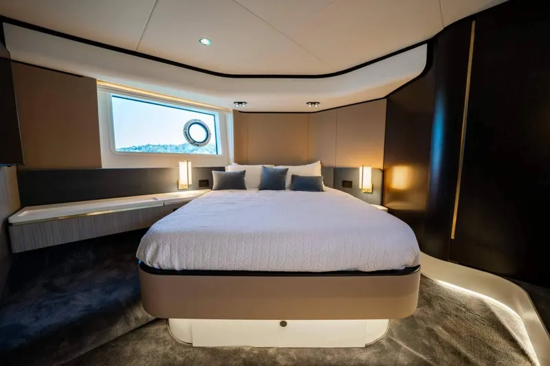  Yacht Photos Pics Luxurious bedroom interior of 2018 Azimut Flybridge yacht with modern design and ambient lighting.