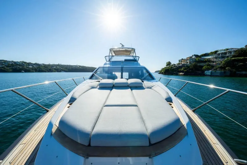  Yacht Photos Pics 2018 Azimut Flybridge yacht on serene water under bright sun.