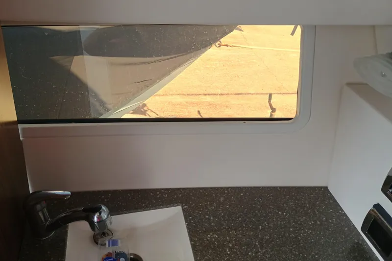 350-004 - Brokerage Joe Yacht Photos Pics Interior view of 2019 Four Winns H350 boat, featuring a sink and window.