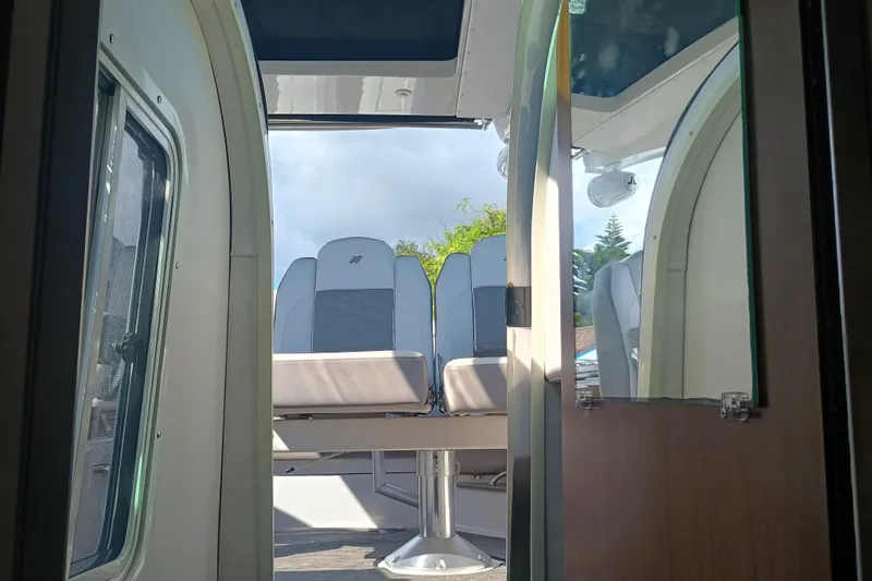 350-004 - Brokerage Joe Yacht Photos Pics Interior view of 2019 Four Winns H350 boat, showcasing seating and cabin details.