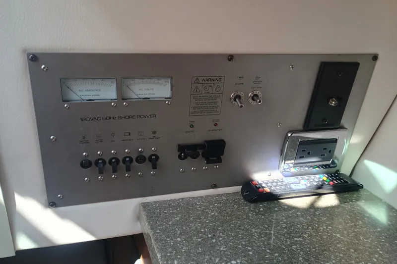 350-004 - Brokerage Joe Yacht Photos Pics Control panel of 2019 Four Winns H350 boat with shore power and outlets.