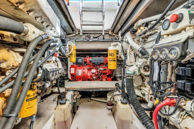  Yacht Photos Pics Engine room of a 1997 Sea Ray 500 Sundancer, showcasing complex machinery and components.