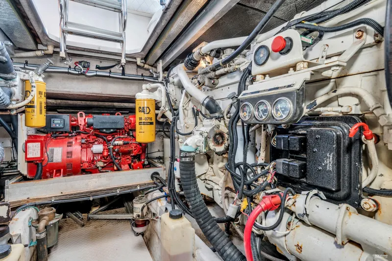  Yacht Photos Pics Engine room of a 1997 Sea Ray 500 Sundancer with visible machinery and components.