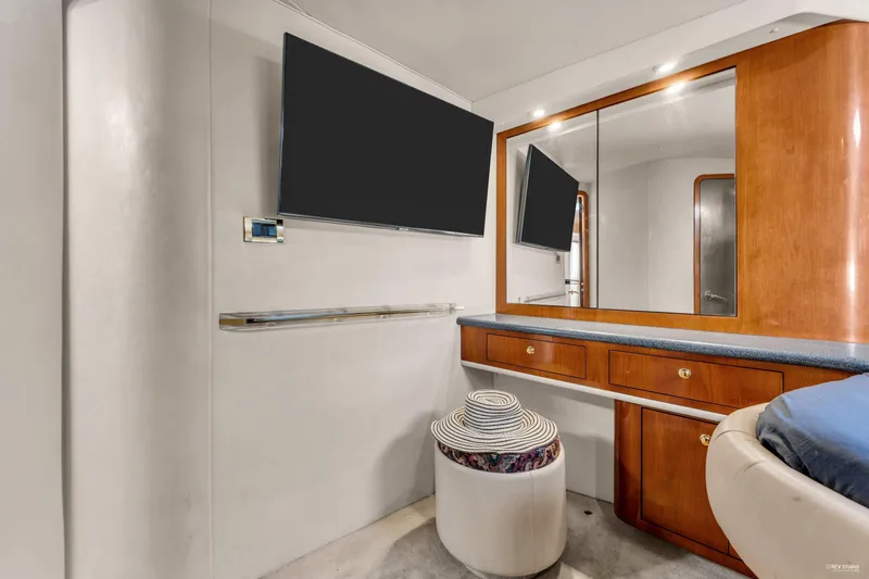  Yacht Photos Pics Interior of 1997 Sea Ray 500 Sundancer with TV, mirror, and wooden cabinetry.