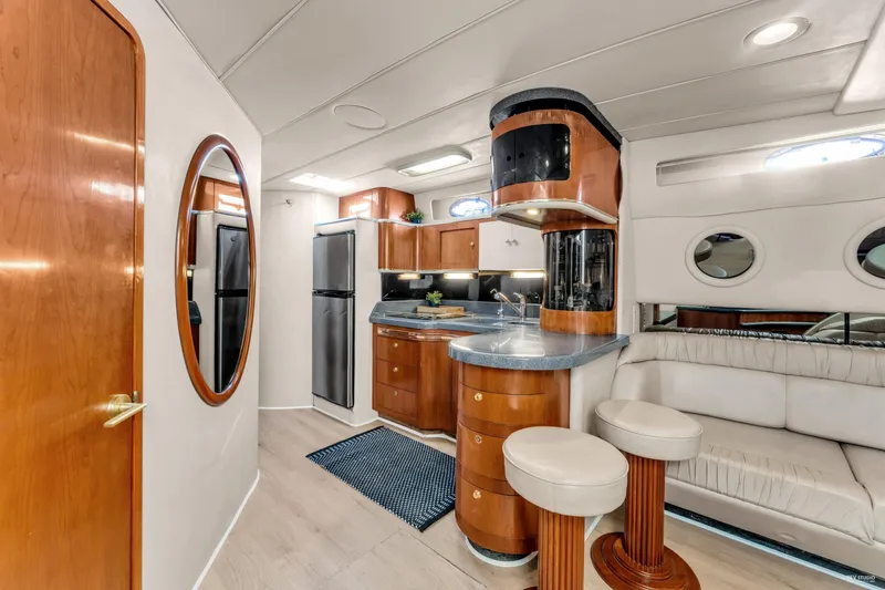  Yacht Photos Pics Luxurious interior of 1997 Sea Ray 500 Sundancer yacht with modern kitchen and seating area.
