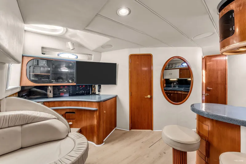  Yacht Photos Pics Luxurious interior of 1997 Sea Ray 500 Sundancer yacht with modern amenities and elegant wood finishes.
