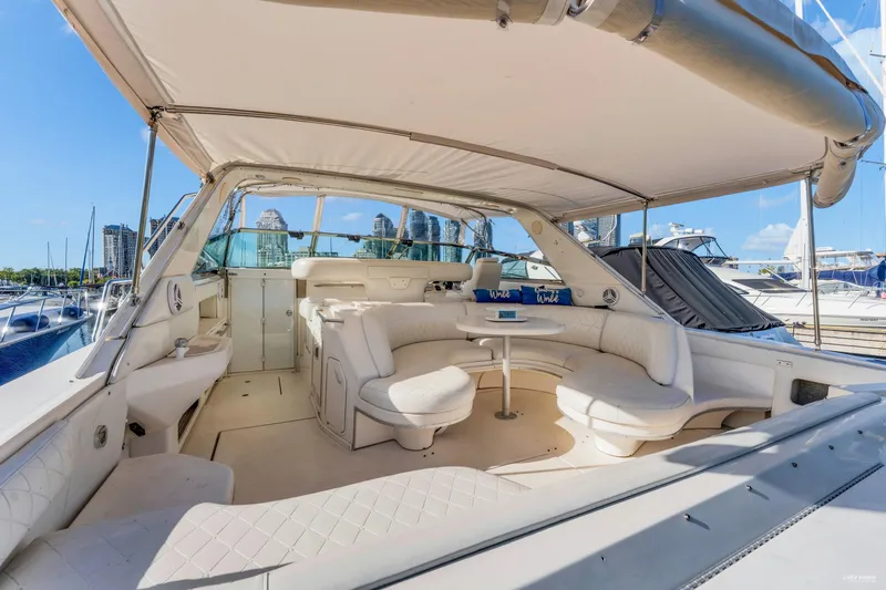  Yacht Photos Pics Luxurious 1997 Sea Ray 500 Sundancer yacht with spacious seating and canopy in marina.