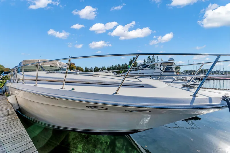 Yacht Photos Pics 1997 Sea Ray 500 Sundancer docked at marina under blue sky.