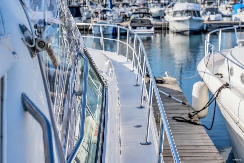 Yacht Photos Pics 1997 Sea Ray 500 Sundancer docked at a marina with other boats.