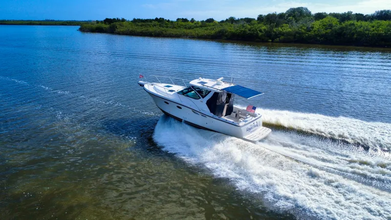  Yacht Photos Pics 2006 Tiara Yachts 3200 Open cruising on a scenic waterway.