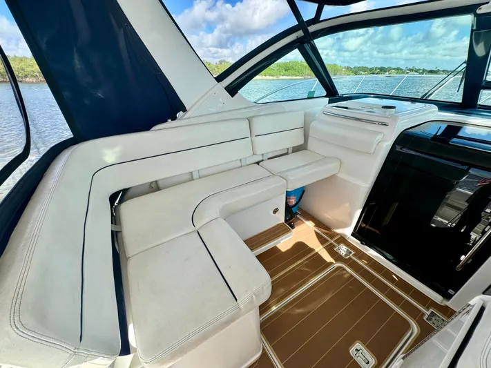  Yacht Photos Pics 2006 Tiara Yachts 3200 Open interior with white seating and scenic water view.