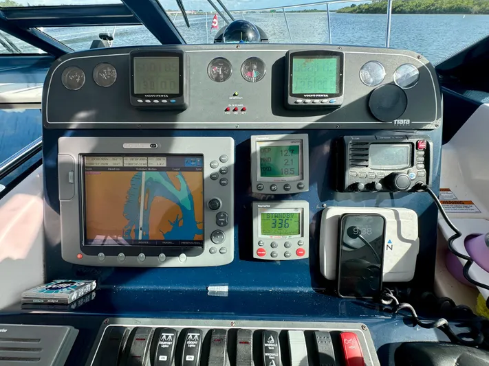  Yacht Photos Pics Control panel of a 2006 Tiara Yachts 3200 Open with navigation and communication equipment.