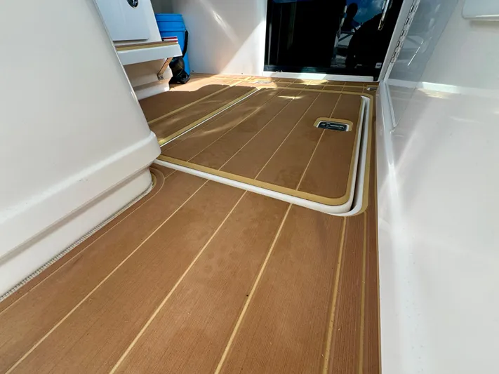  Yacht Photos Pics 2006 Tiara Yachts 3200 Open interior with teak flooring and storage compartment.