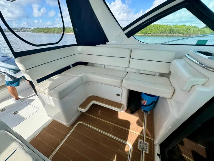  Yacht Photos Pics 2006 Tiara Yachts 3200 Open interior with white seating and wooden flooring.