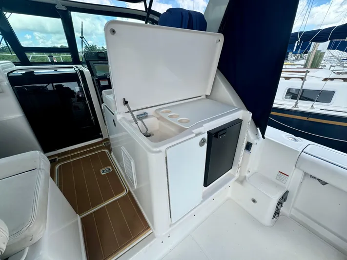  Yacht Photos Pics 2006 Tiara Yachts 3200 Open interior with kitchenette and seating area.