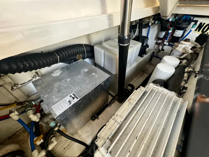  Yacht Photos Pics Engine compartment of 2006 Tiara Yachts 3200 Open, showcasing mechanical components and wiring.