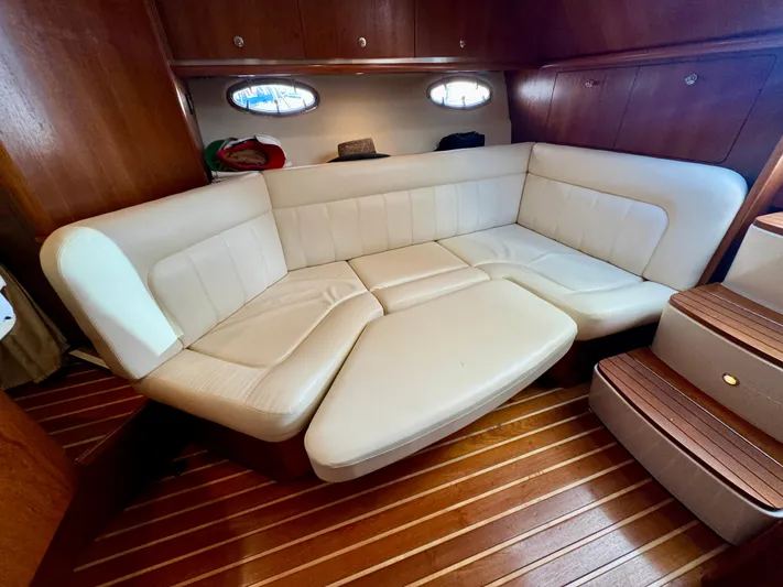  Yacht Photos Pics Luxurious interior of 2006 Tiara Yachts 3200 Open with cream leather seating and wooden flooring.