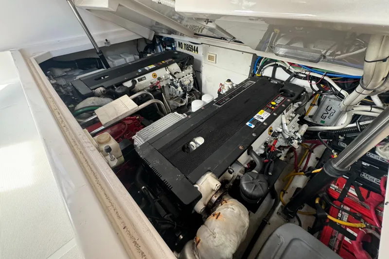  Yacht Photos Pics Engine compartment of a 2006 Tiara Yachts 3200 Open, showcasing dual engines and wiring.