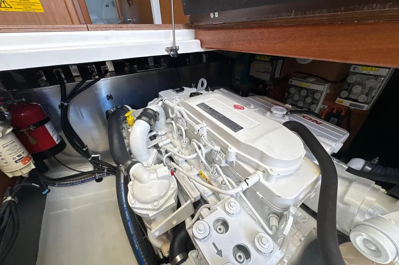 R&r Yacht Photos Pics Engine room of 2023 Beneteau Swift Trawler 35, showcasing detailed mechanical components.