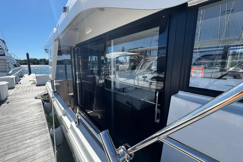 R&r Yacht Photos Pics 2023 Beneteau Swift Trawler 35 docked, showcasing sleek design and modern features.