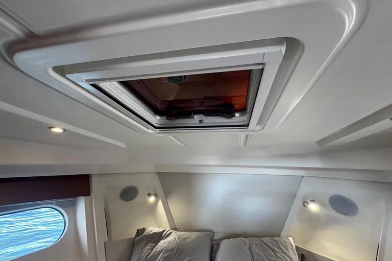 R&r Yacht Photos Pics 2023 Beneteau Swift Trawler 35 cabin interior with skylight and modern lighting.
