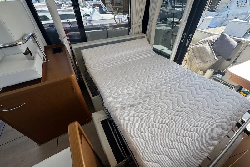 R&r Yacht Photos Pics 2023 Beneteau Swift Trawler 35 interior with convertible bed and modern design.