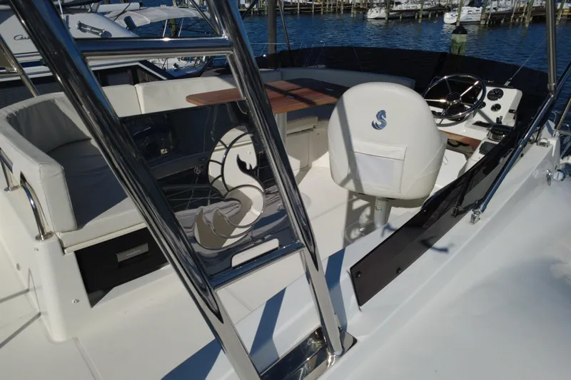 R&r Yacht Photos Pics 2023 Beneteau Swift Trawler 35 cockpit with helm, seating, and polished details.