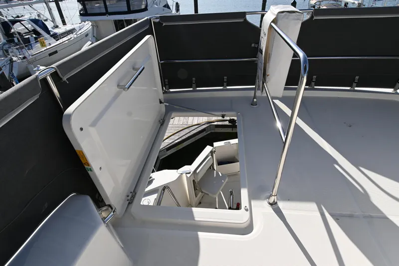 R&r Yacht Photos Pics 2023 Beneteau Swift Trawler 35 deck with open hatch and railing.