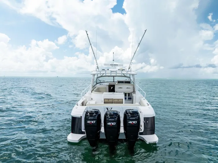 Virgo Yacht Photos Pics 2018 Intrepid 430 Sport Yacht on open water with triple outboard engines.