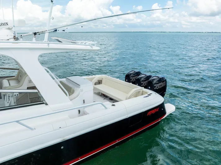 Virgo Yacht Photos Pics 2018 Intrepid 430 Sport Yacht on water, featuring triple outboard engines.