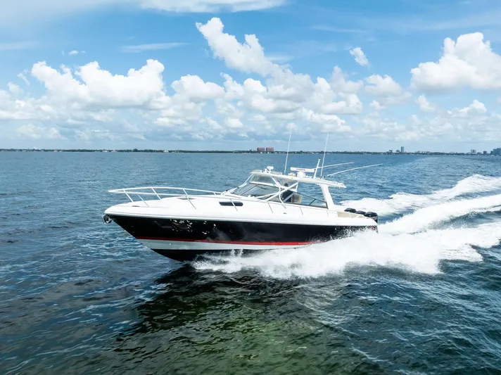 Virgo Yacht Photos Pics 2018 Intrepid 430 Sport Yacht cruising on open water under a clear blue sky.