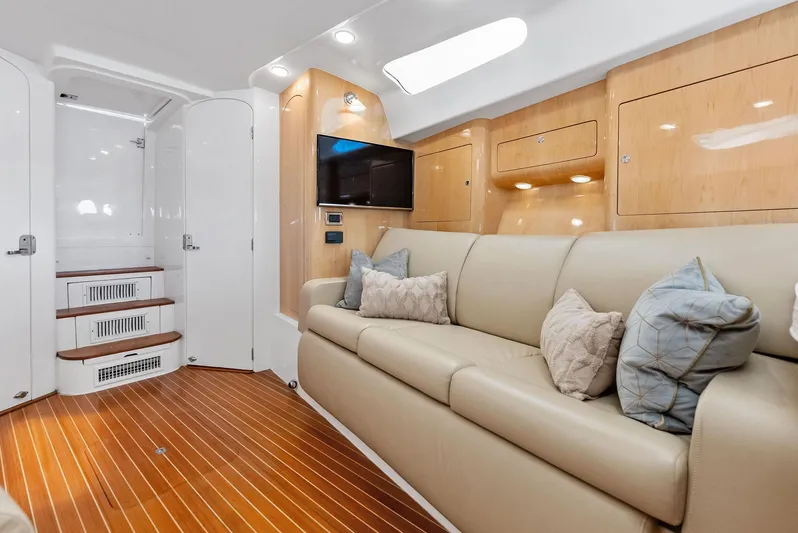 Virgo Yacht Photos Pics Luxurious interior of 2018 Intrepid 430 Sport Yacht with plush seating and modern amenities.