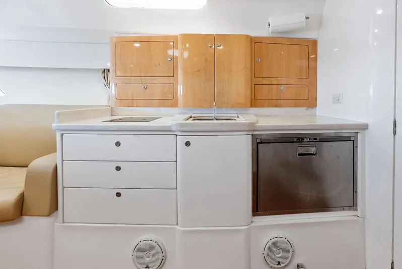 Virgo Yacht Photos Pics 2018 Intrepid 430 Sport Yacht interior kitchen with cabinets, sink, and dishwasher.