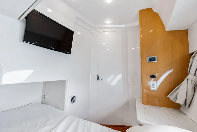 Virgo Yacht Photos Pics 2018 Intrepid 430 Sport Yacht cabin interior with TV and modern amenities.