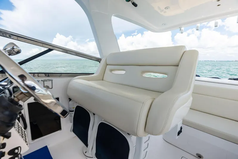 Virgo Yacht Photos Pics 2018 Intrepid 430 Sport Yacht interior with white seating and ocean view.