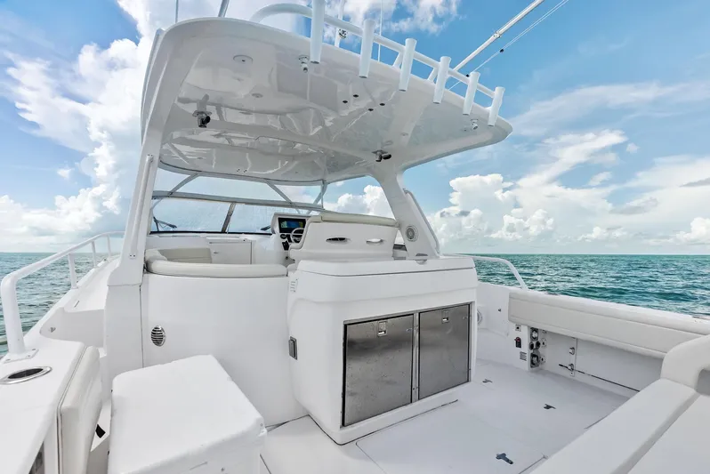 Virgo Yacht Photos Pics 2018 Intrepid 430 Sport Yacht interior with ocean view, featuring sleek white design and modern amenities.