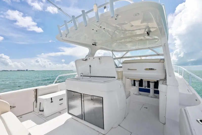 Virgo Yacht Photos Pics 2018 Intrepid 430 Sport Yacht interior with seating, storage, and ocean view.