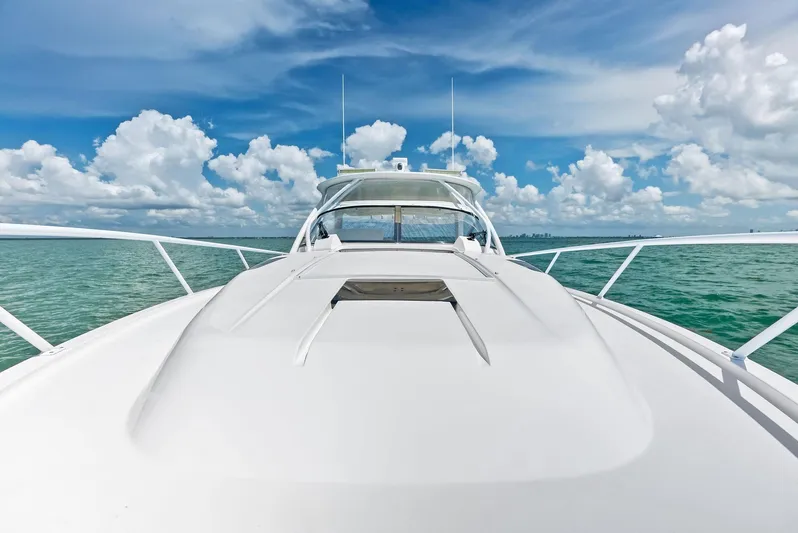 Virgo Yacht Photos Pics 2018 Intrepid 430 Sport Yacht on open water under a vibrant blue sky.