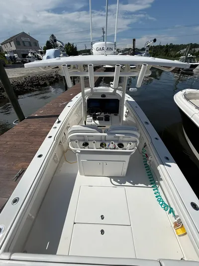  Yacht Photos Pics 2018 Jupiter 26 FS boat docked, featuring a center console and Garmin equipment.