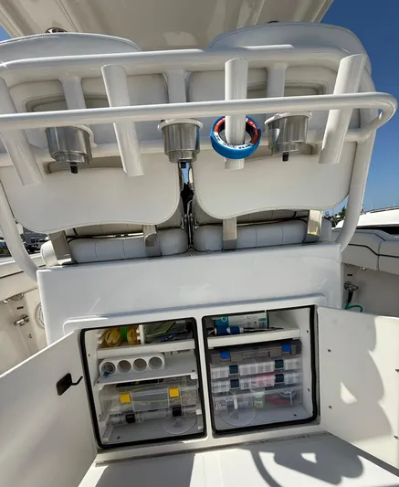  Yacht Photos Pics 2018 Jupiter 26 FS boat with open storage compartments and fishing gear.