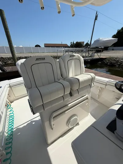  Yacht Photos Pics 2018 Jupiter 26 FS boat with dual white cushioned seats on deck.
