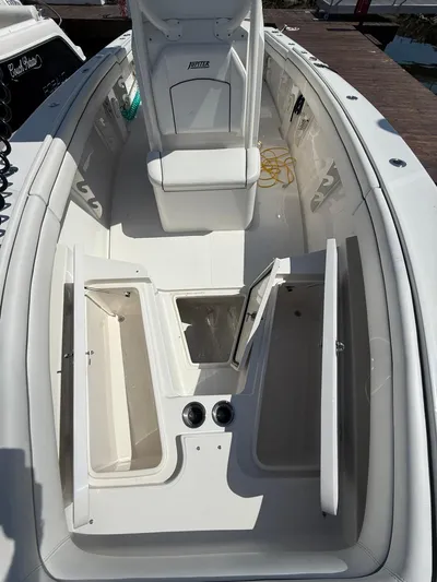  Yacht Photos Pics 2018 Jupiter 26 FS boat interior with open storage compartments and seating.